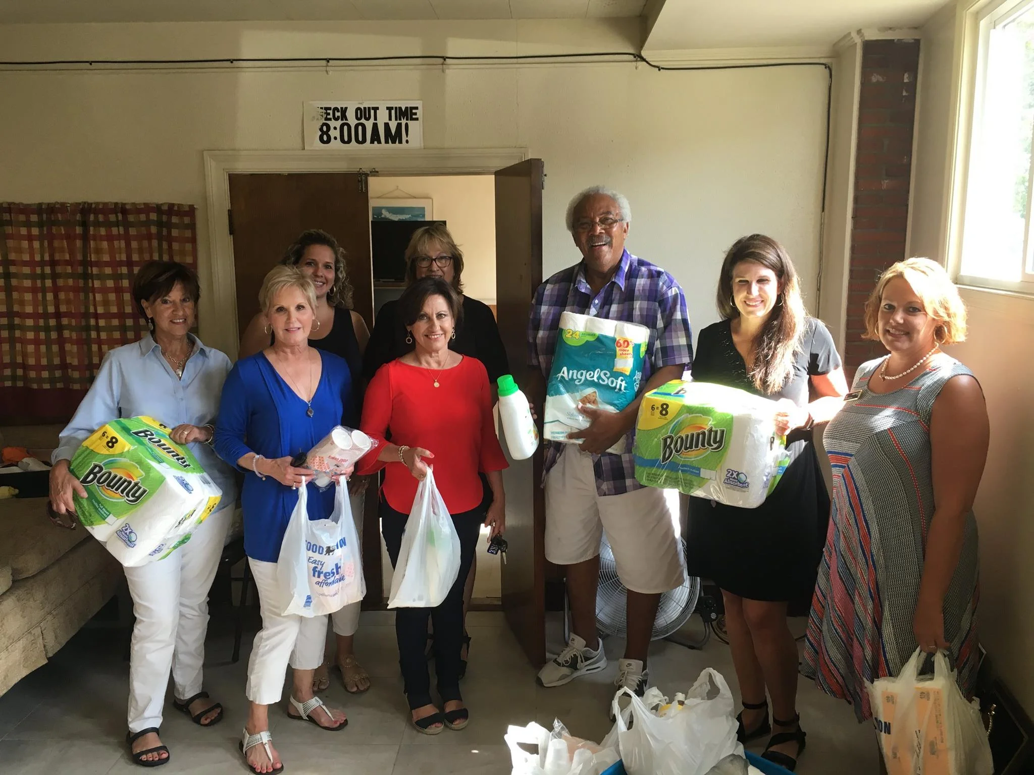 Community members bringing household supplies to Friends of the Homeless Shelter